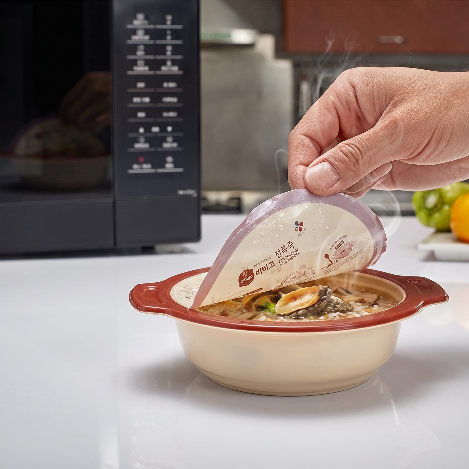 Easy Peel Film for Retort Food F4531, 30 micron EO-RCPP lidding film, shown peeling the easy-open lid from a microwaved retort porridge bowl